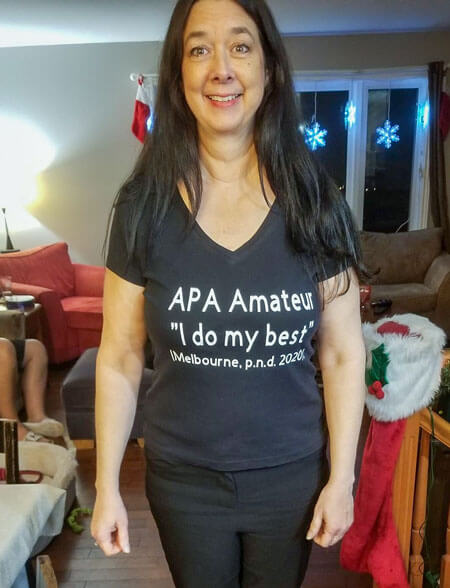 Athabasca University grad Kimberley Melbourne modelling a new APA T-shirt