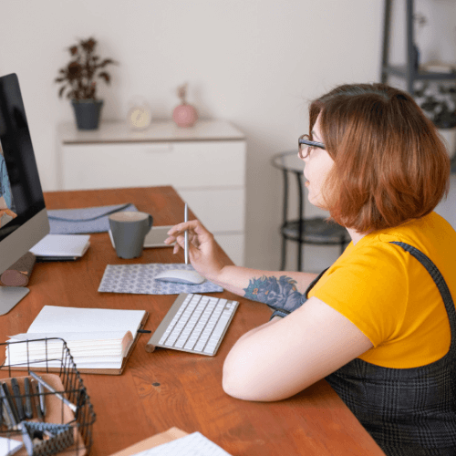 Woman on computer with another person on the screen