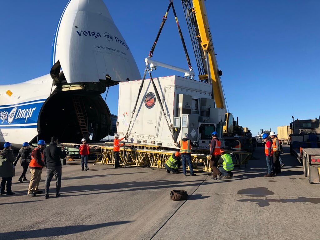 Loading the satellite in its shipping container onto the Antonov-124