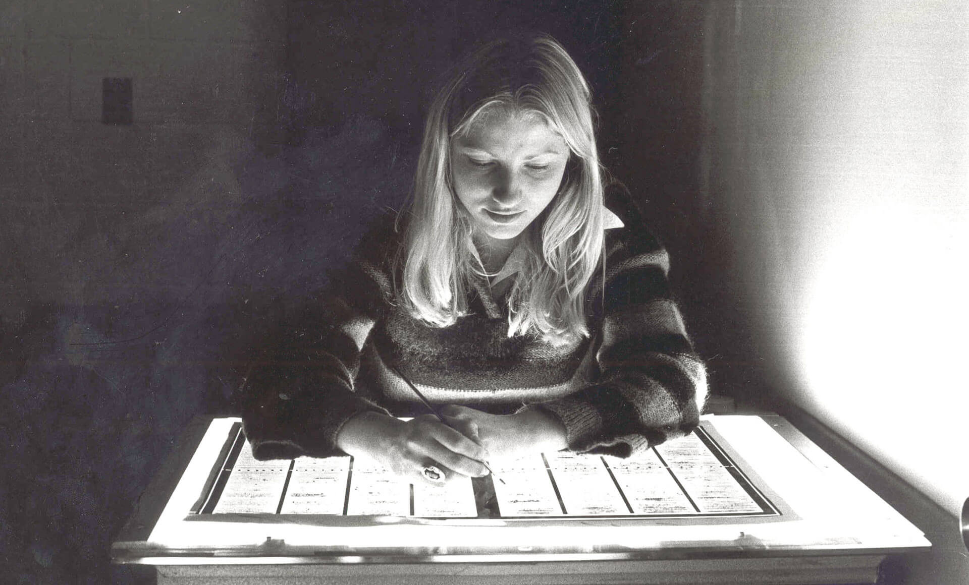 vintage photo of a woman at a light table