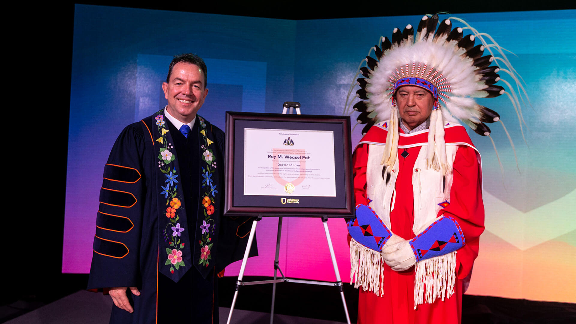 Peter Scott with Roy Weasel Fat, who is wearing a headdress