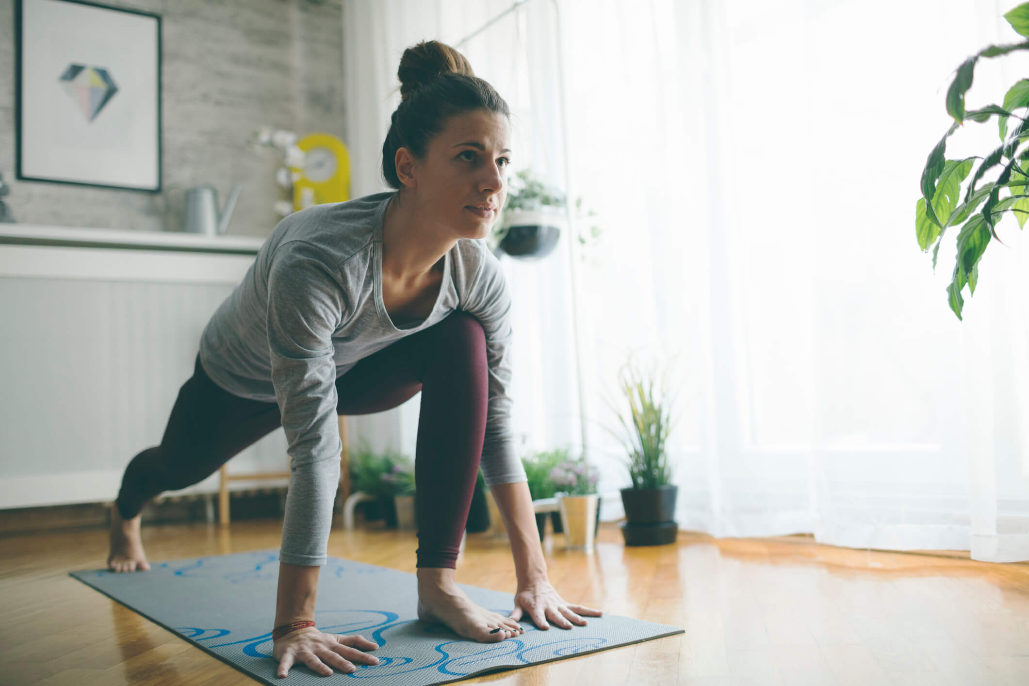 woman doing yoga at home