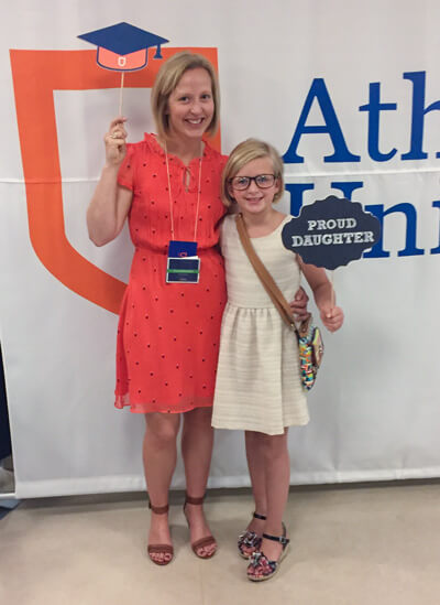 Master of Counselling grad Cara Zaharychuk and daughter at AU convocation