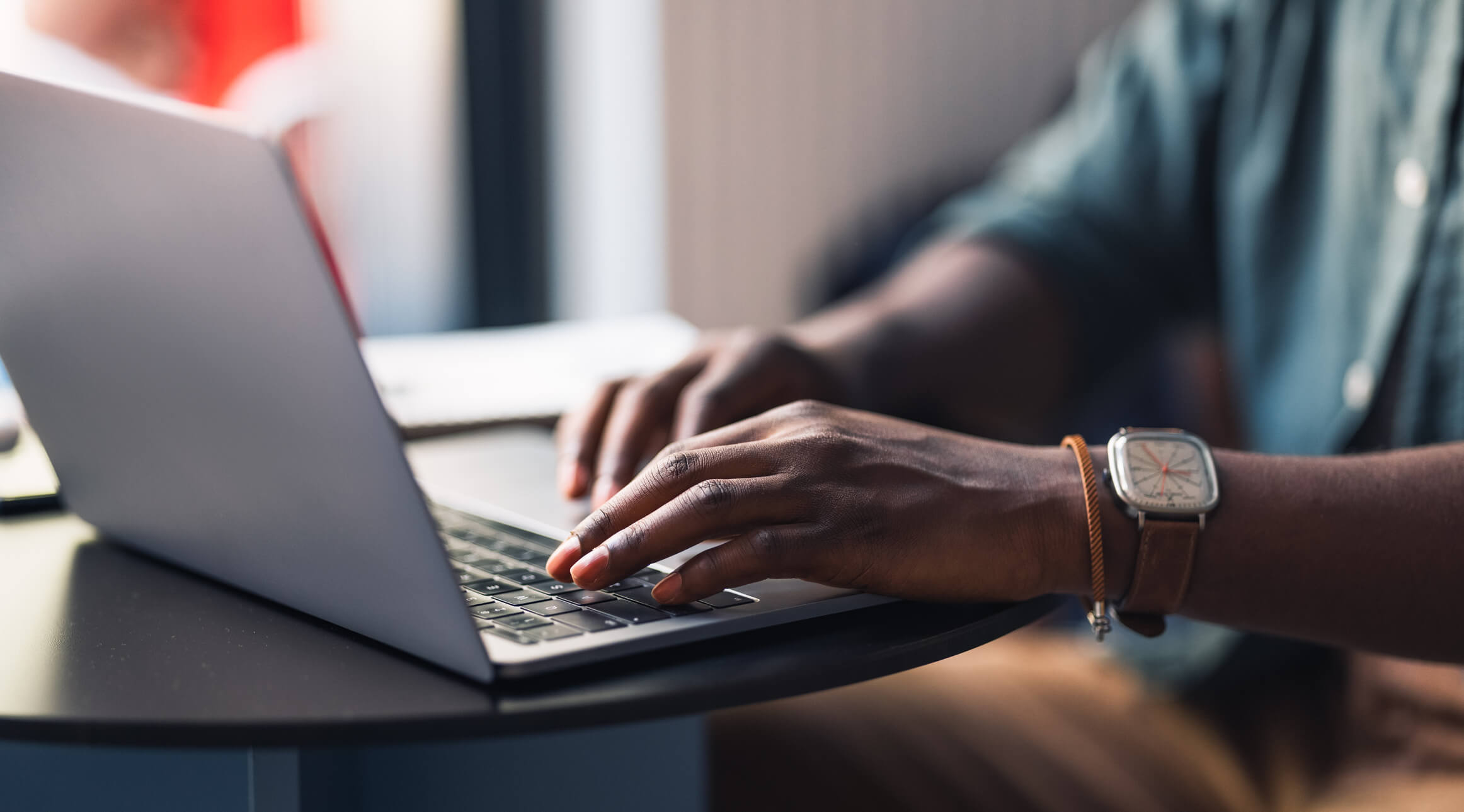 person typing on a laptop