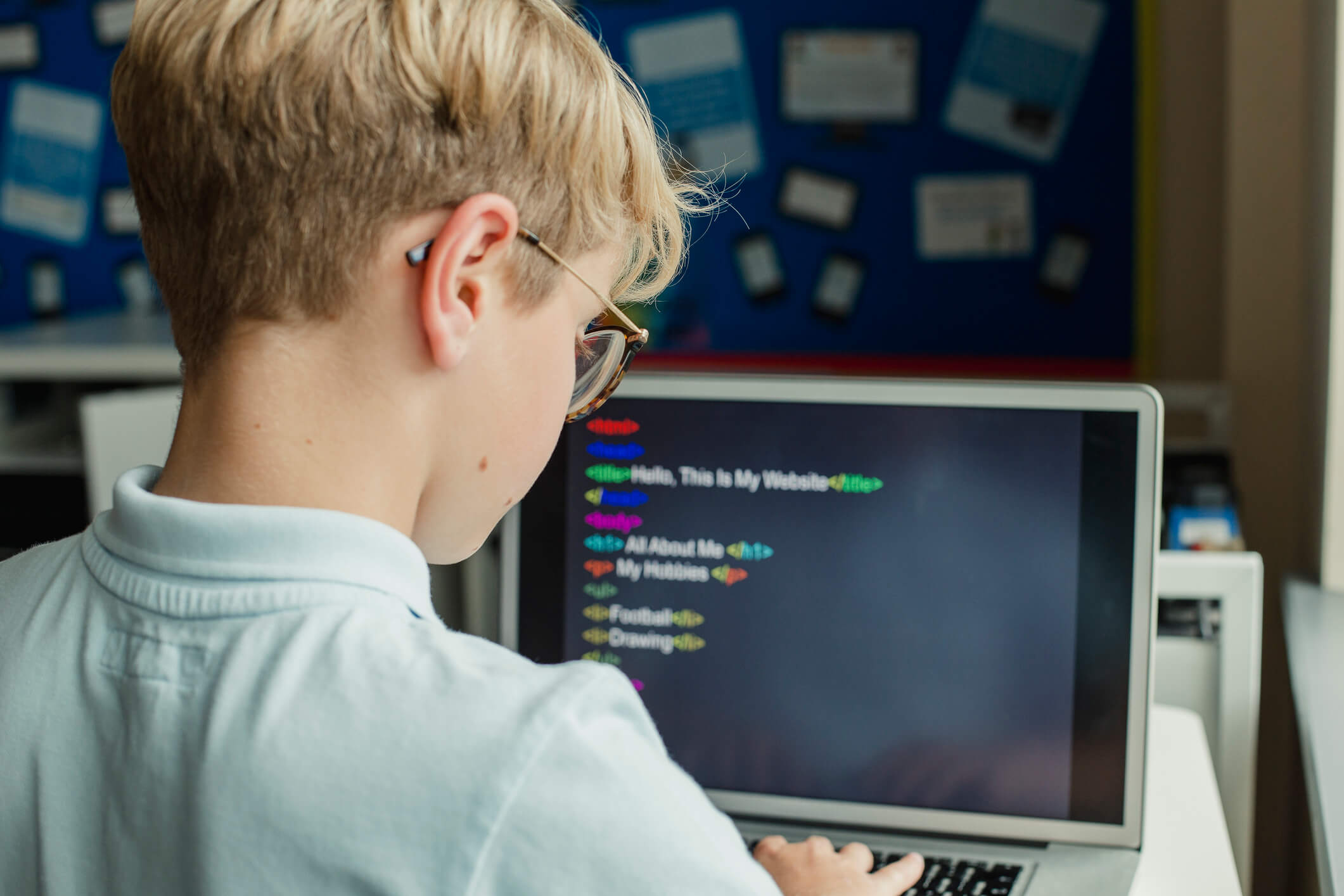 student learning to code on a computer