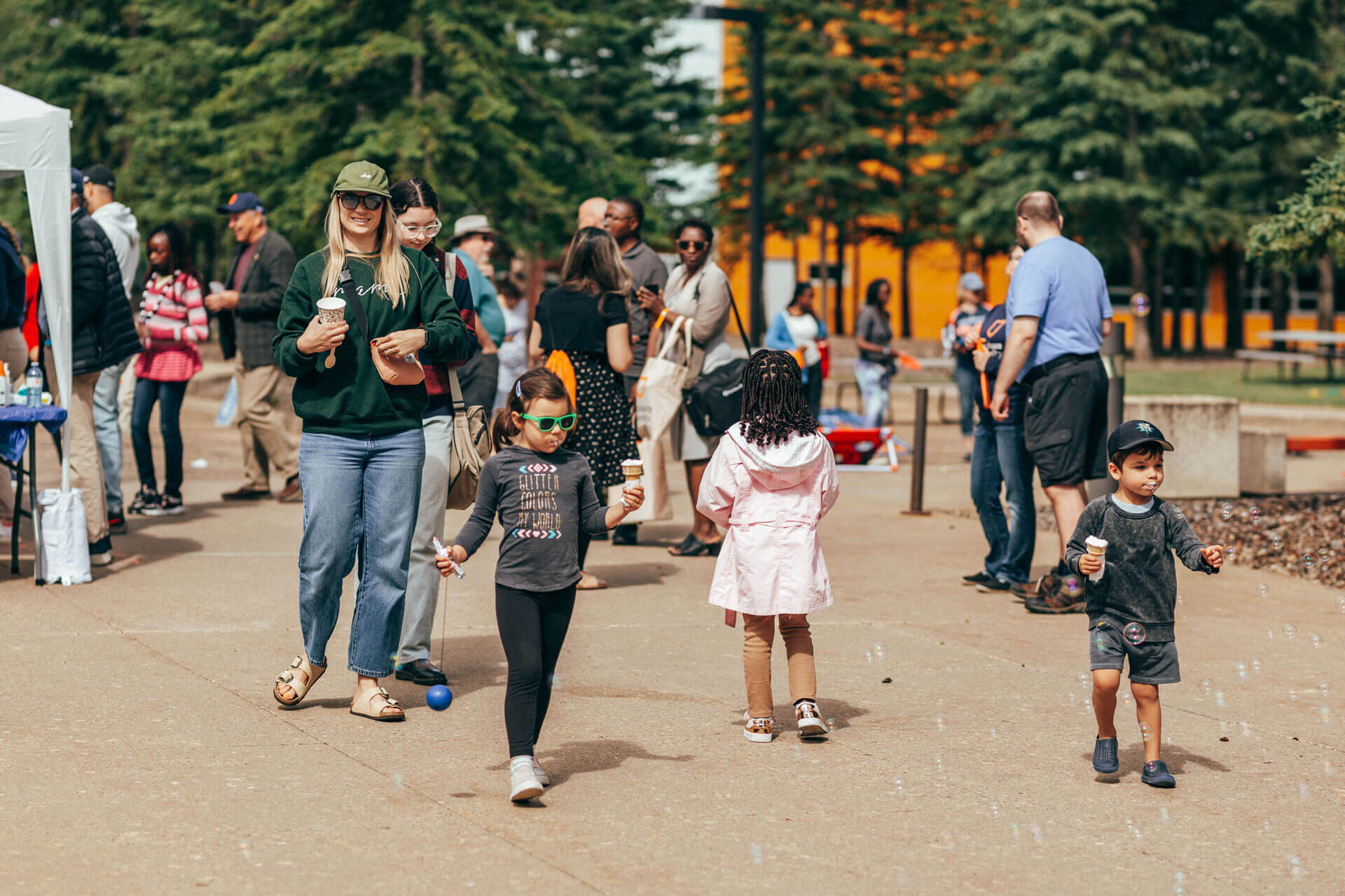 A family enjoys ice cream treats at Athabasca University’s main campus for homecoming June 18.