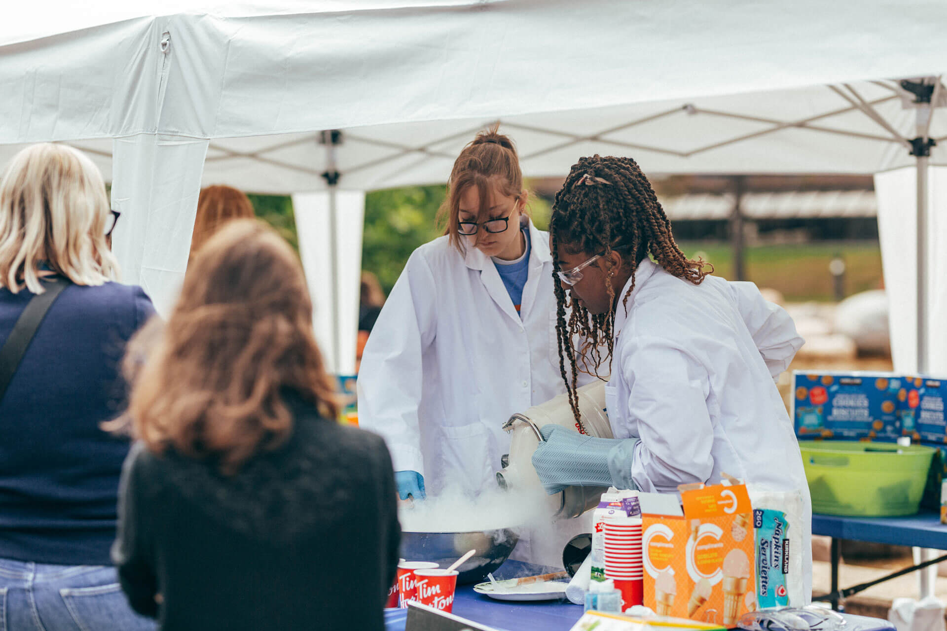 AU staffers demonstrate how to make ice cream using liquid nitrogen