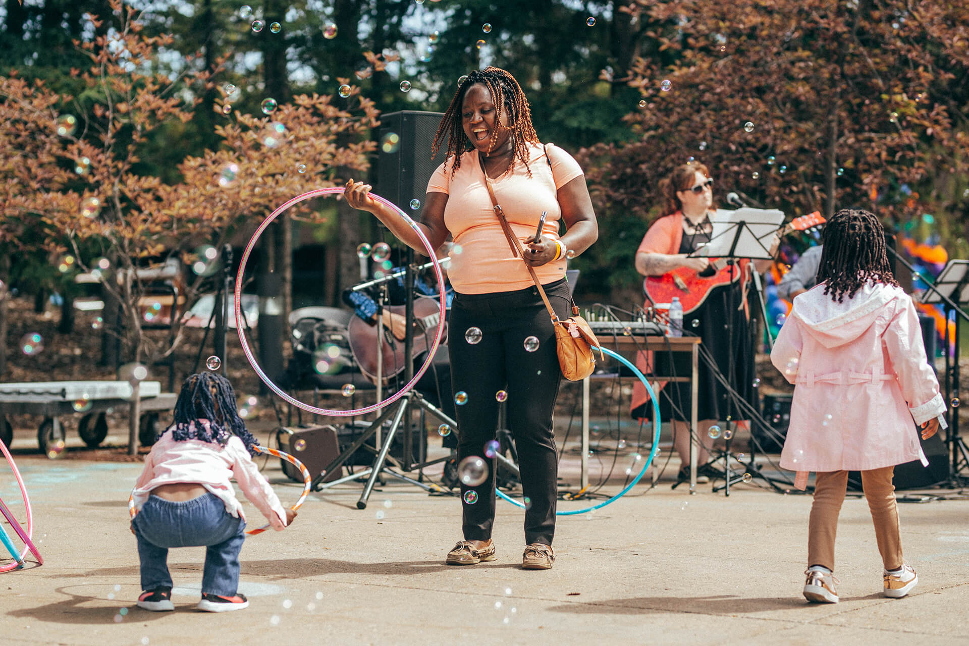 guests play with a hula hoop at Athabasca University’s main campus for homecoming June 18.