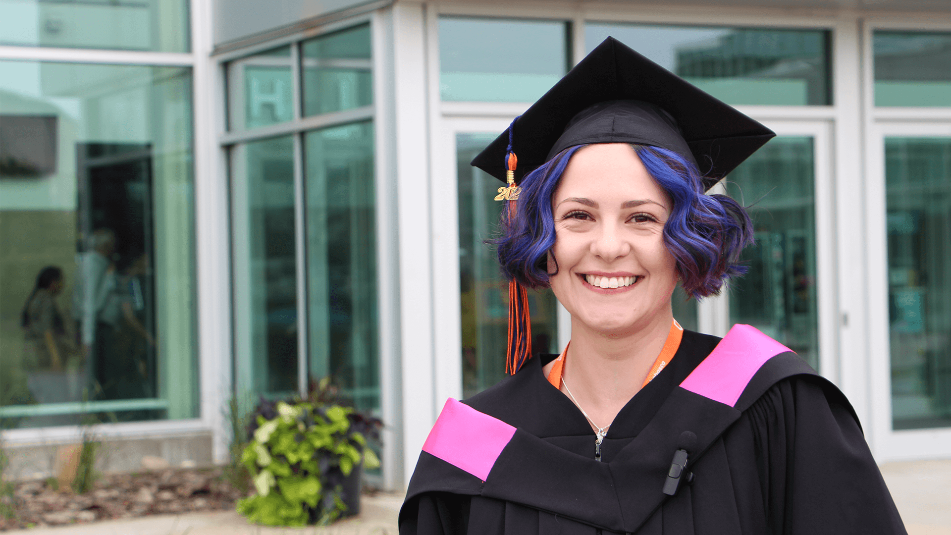 smiling photo of AU graduate outside