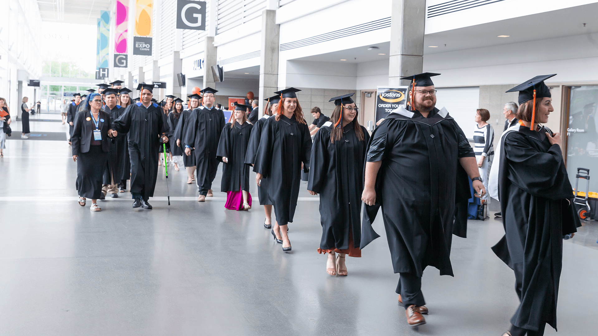 shot of a bunch of graduates walking in the procession