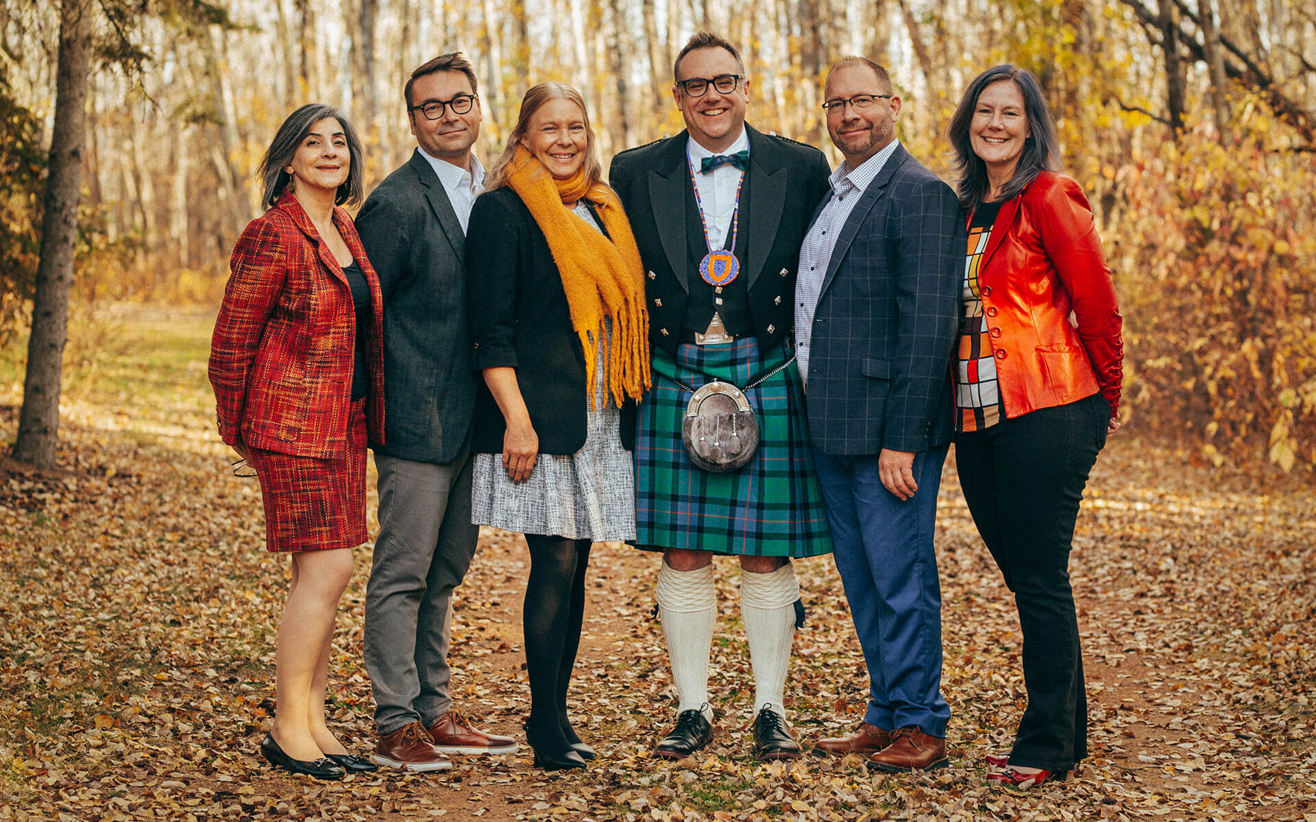 Dr. Alex Clark (centre) with AU's deans (from left): Dr. Manijeh Mannani, Dr. Shawn Fraser, Dr. Shauna Zenteno, Dr. Steve Johnson, Dr. Lisa Watson.