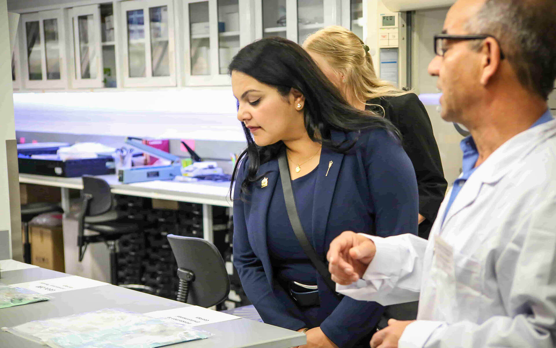 Rajan Sawhney peers at a lab bench