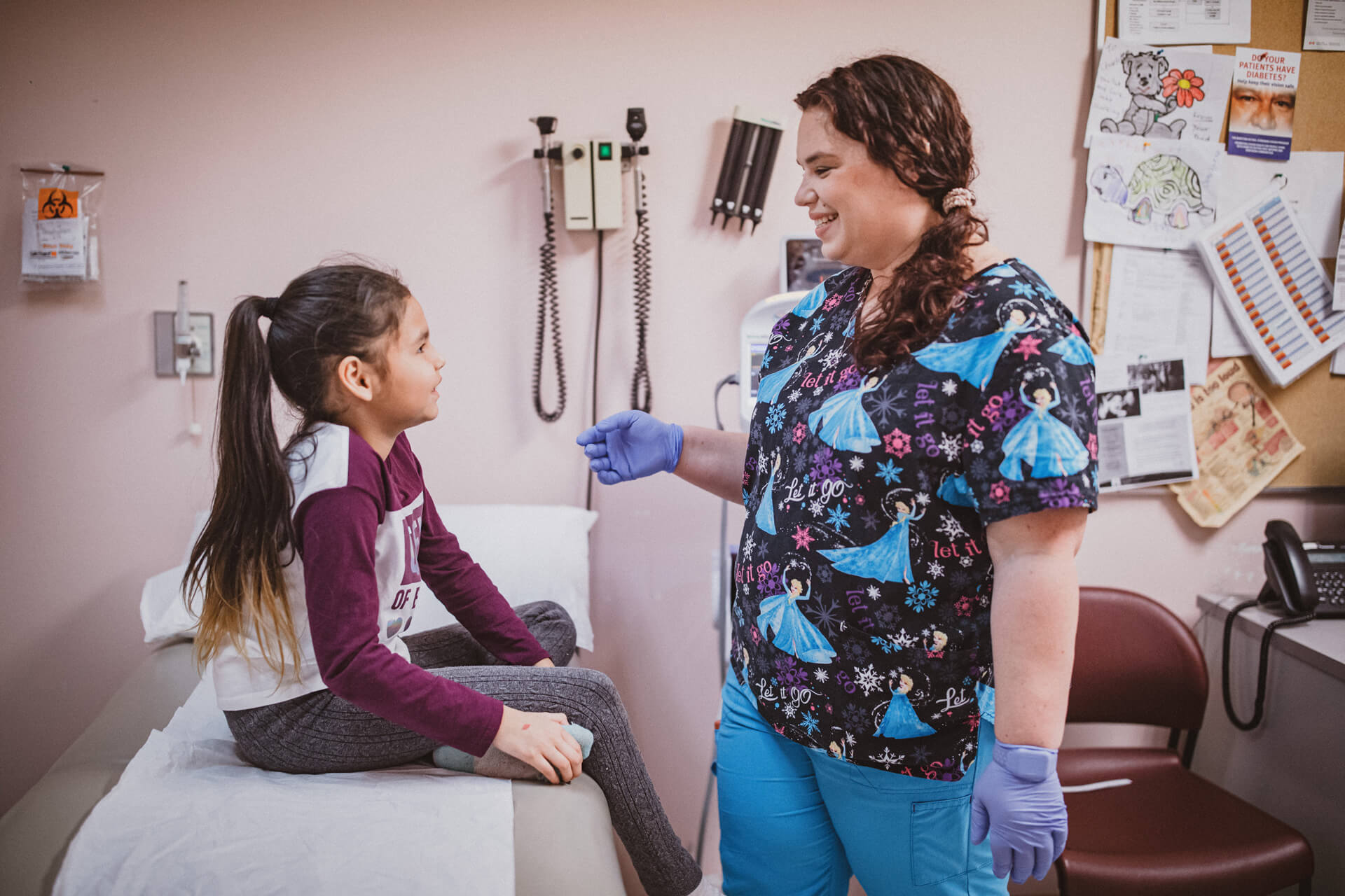 nurse treating a young patient