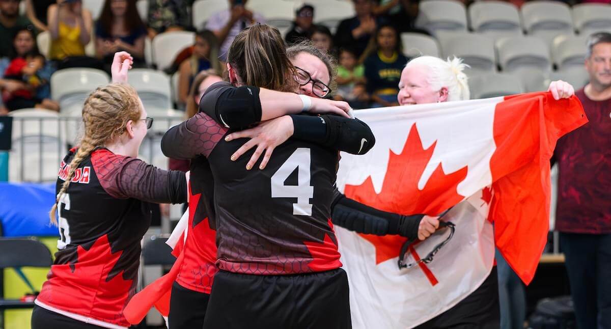 Baldock and the team Canada Goalball team celebrating their win