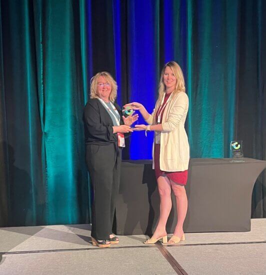 Jill Calliou (left) receiving the Canadian Association of Research Administrators Spirit of Kindness Award