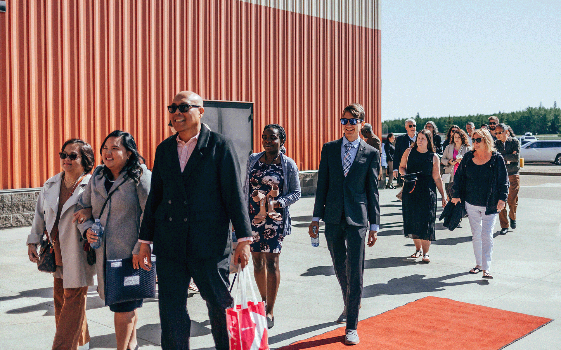 Group of people walking in Athabasca University convocation