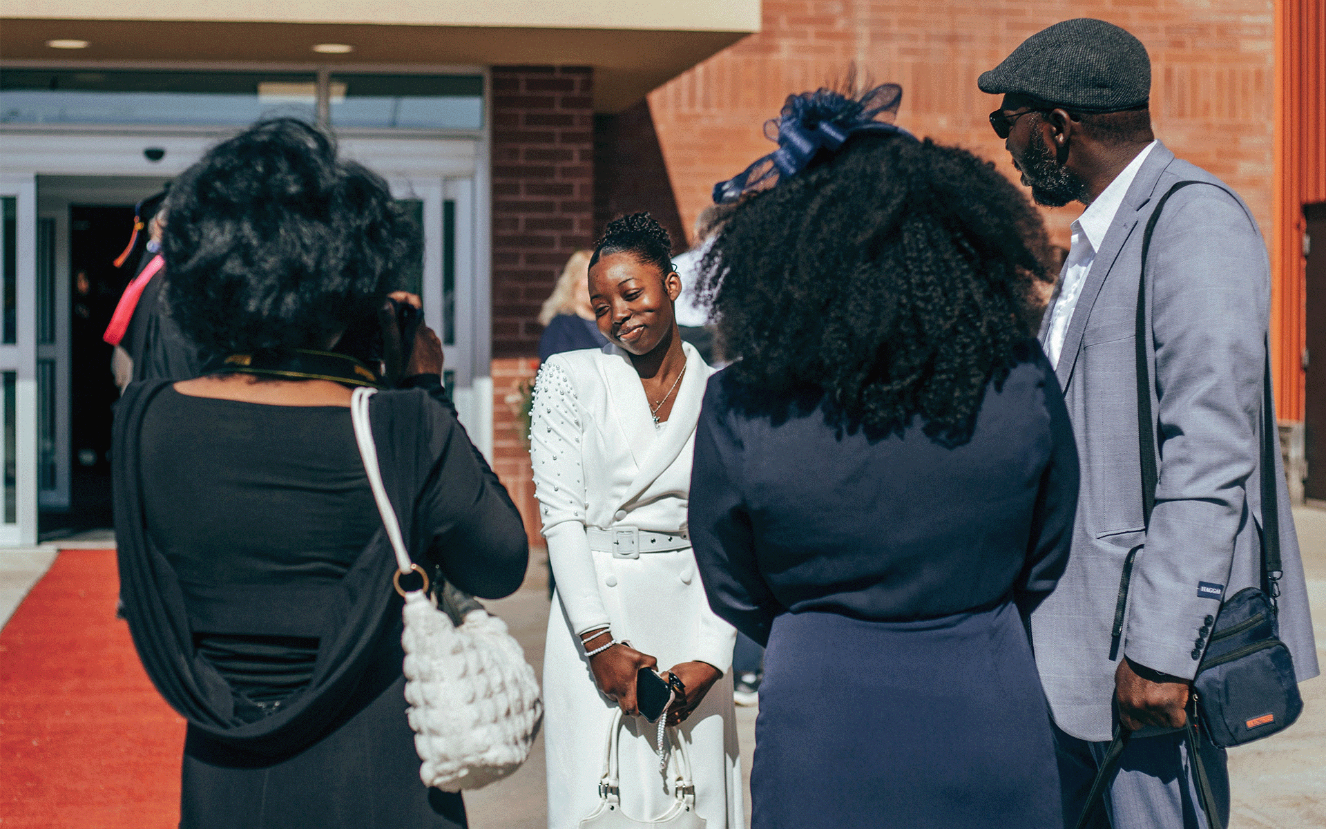 woman in white dress getting photos taken