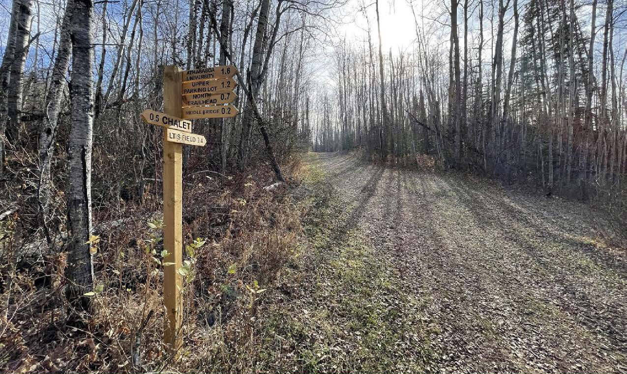 A view of wayfinding signage at Muskeg Creek Trail