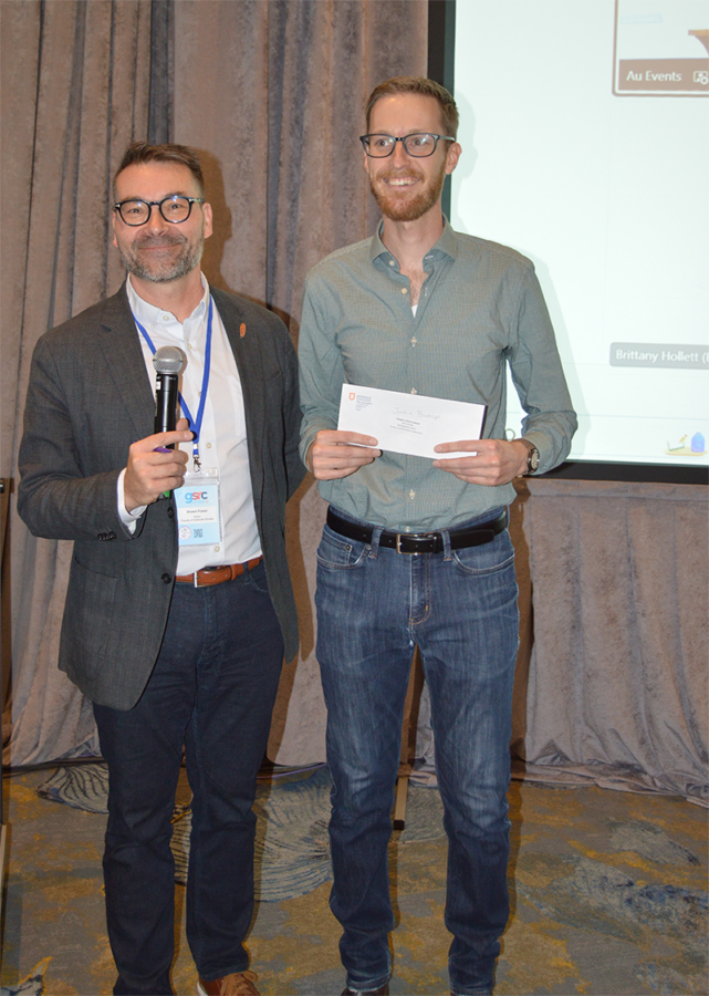 Justin Brokop, accepting People's Choice Award from Dr. Shawn Fraser