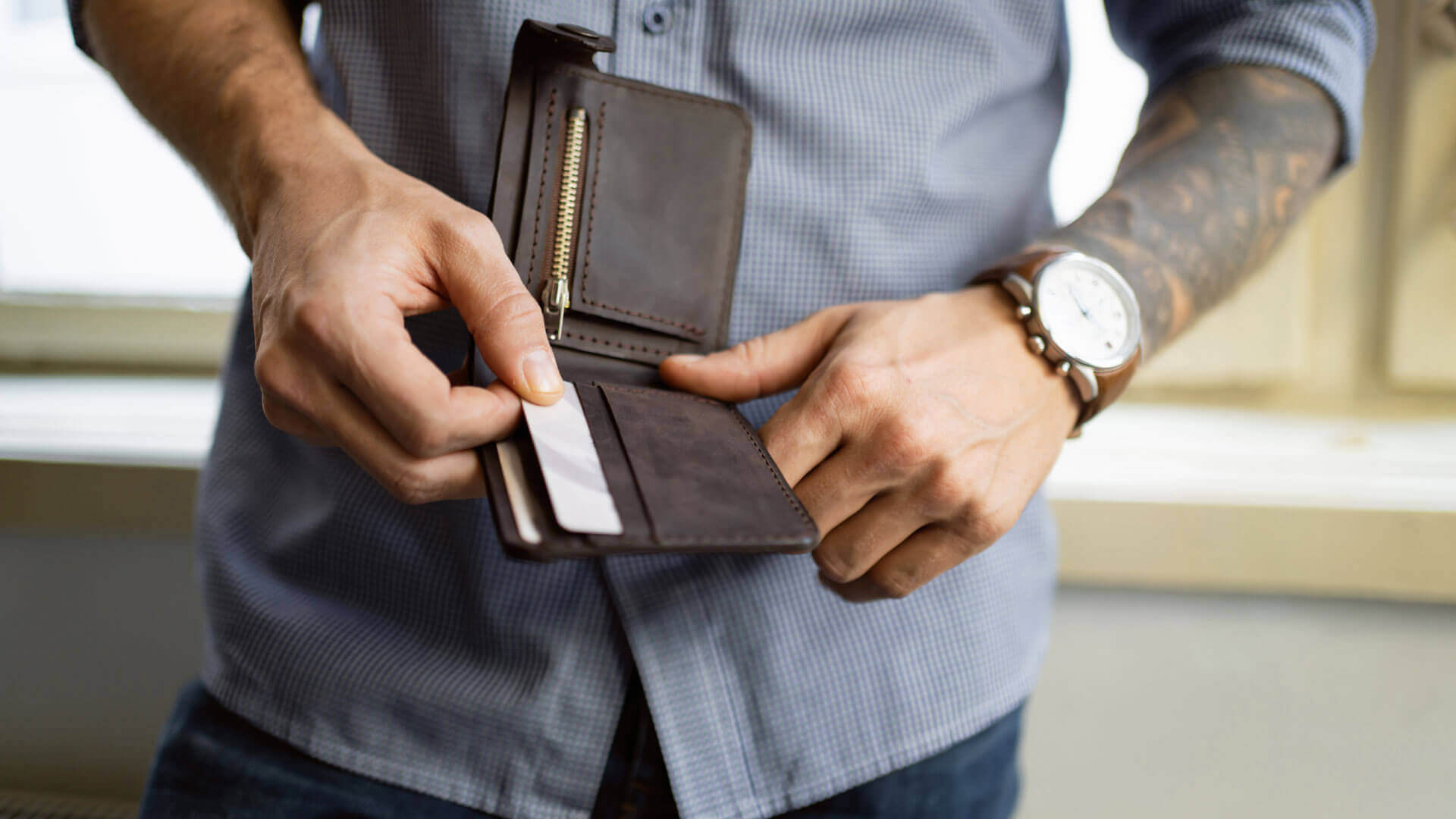 man holding an open wallet